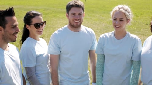 Group Of Volunteers Making High Five In Park 13
