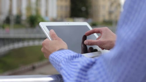 Man Working on the Tablet