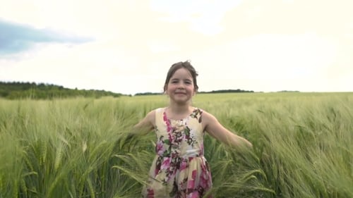 Little Girl Running Across Wheat Field