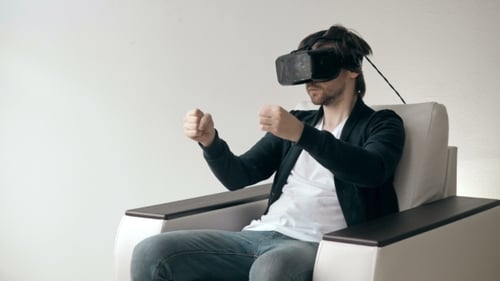 Man Wearing Virtual Reality Glasses Watching Movies Or Playing Video Games