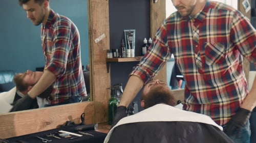 Barber Preparing Client for a Traditional Shave
