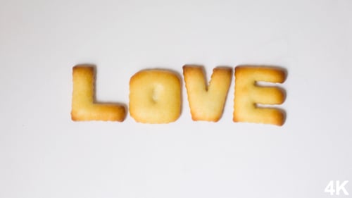 Crackers Spell Love on White Background