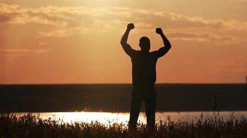 Silhouette of Sportsman Training at Sunset