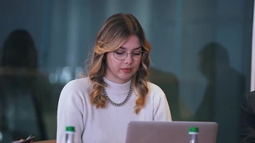Secretary Girl Typing on Laptop