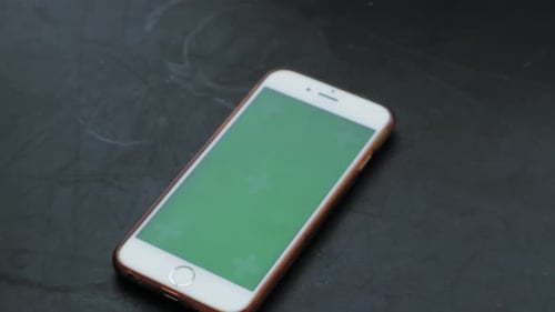 Smart Phone, On Black Rustic Table. Green Screen