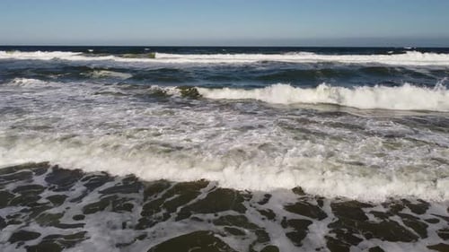 Aerial View of Sandy Beach and Sea Waves