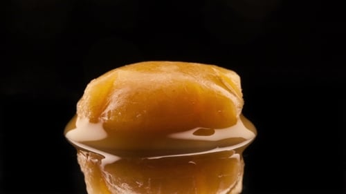 Melting Caramel Candy in Close Up on Black