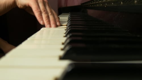 Close Up of Woman Playing Classical Piano Music