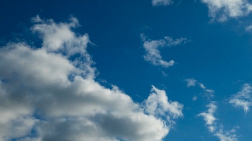 Clip of White Fluffy Clouds Over Blue Sky. Beautiful Cloudscape