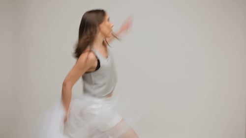 Woman with Brown Hair Dancing in Shiny Shorts