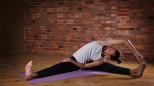 Man Stretching and Doing Yoga Indoors
