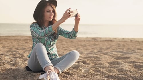 Beautiful Young Woman Doing Selfie On The Beach