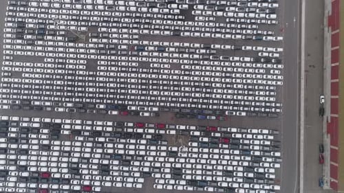 Aerial View of Thousands of New Cars in Urban Lot