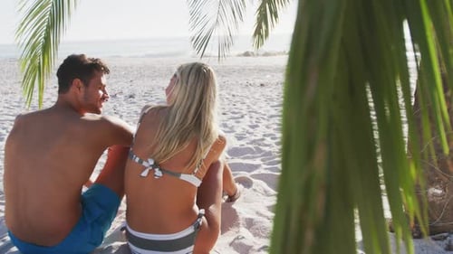 Caucasian couple enjoying time at the beach