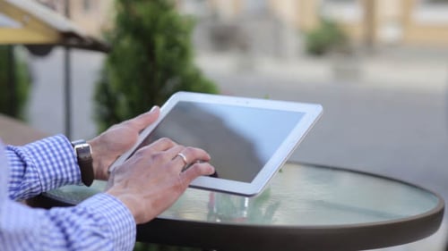 Man Working on the Tablet