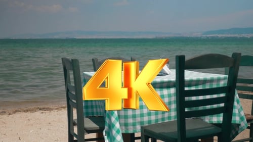 View On Table And Four Chairs On Coastline