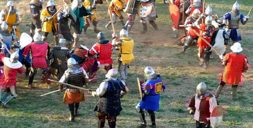 Medieval Knights in Armor Fighting in a Field