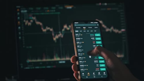 Analyzing Stock Data on Phone and Computer Screen