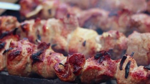 BBQ Meat Grilling On Wood Coal. Cooking Shish Kebab On Metal Skewers