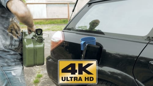 Man Fuels Car From Jerry Can Petrol Gas Or Diesel