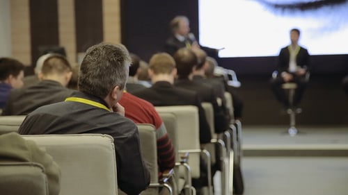Audience Attending Business Conference and Presentation