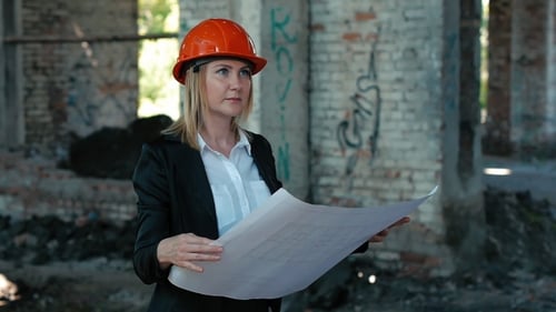 Architect Standing on Construction Site