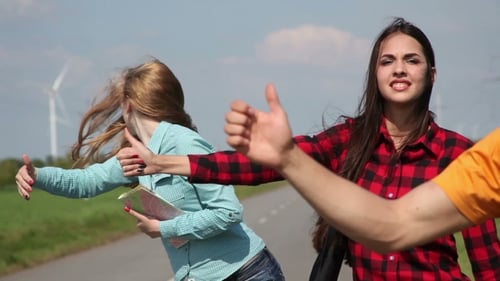 Friends Hitchhiking on Rural Road, Thumbs Up