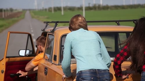 Friends on a Road Trip with Wind Turbines
