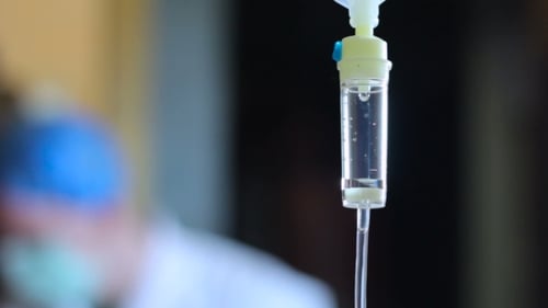 Intravenous Drip Dropper Against Background Of a Doctor 2