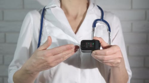 Doctor Explains Pulse Oximeter Device in Medical Setting