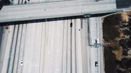 Beautiful Cinematic Aerial Shot of Cars Moving Through American Interstate Highway with Multiple