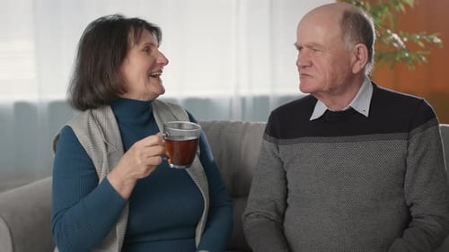 Mature Couple Relaxing and Drinking Tea