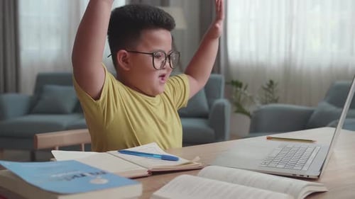 Boy Engaged in Online Class at Home