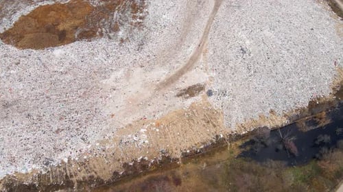 Aerial drone view of stack of different types of large mountain garbage pile
