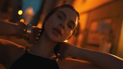 the Girl in the Light of the Lanterns of the Evening Street