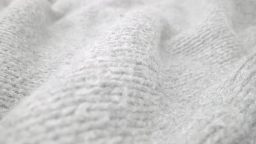 Extreme Detail View of Sheep Wool Cloth Texture Flowing in Macro Dolly Shot