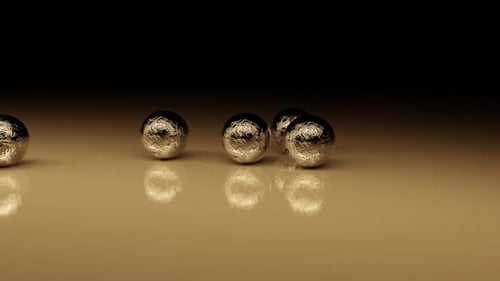 Abstract Golden Spheres Rolling Animated Background