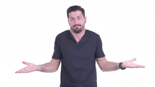 Confused Young Handsome Bearded Man Shrugging Shoulders