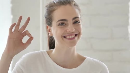 Woman Giving Okay Sign, Close Up