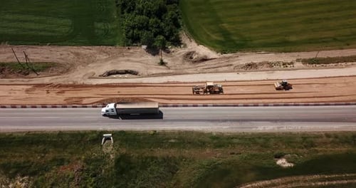 Road Construction Site with Machinery, Bulldozer, Excavation From Above. Video, Aerial View