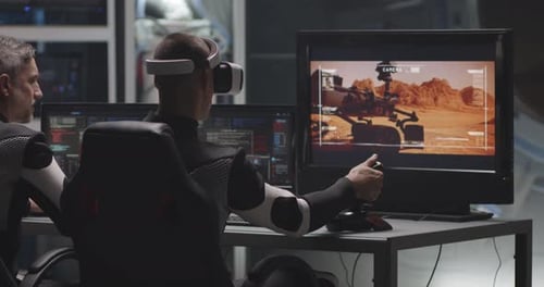 Men in Futuristic Suits Controlling Mars Rover