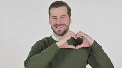 Smiling Man Makes Heart Shape With Hands