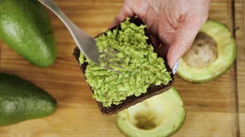 Preparing Healthy Avocado Toast at Home