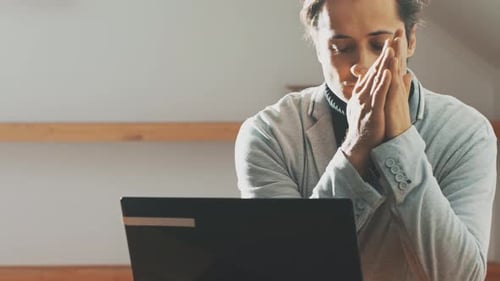 The Man Thought About Working in Front of the Laptop