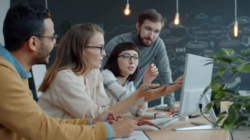Slow Motion of Men and Women Brainstorming Speaking About Business in Shared Office