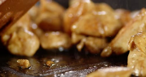 Close Up of Chicken Cooking in Pan