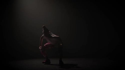 Teenager in Casual Clothers Dance Improvising in Black Studio. King Making Up Movements. Creative