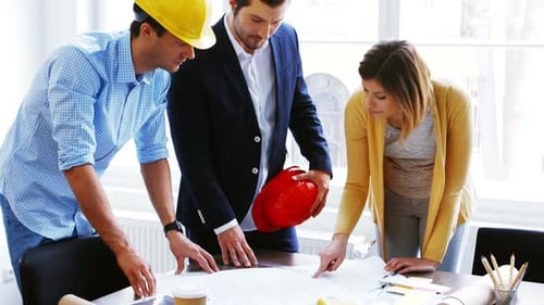 Architects Collaborate on a Project in Urban Office