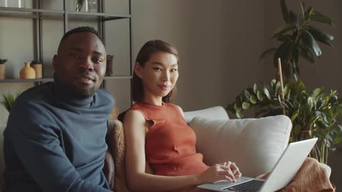 Young Couple with Laptop at Home