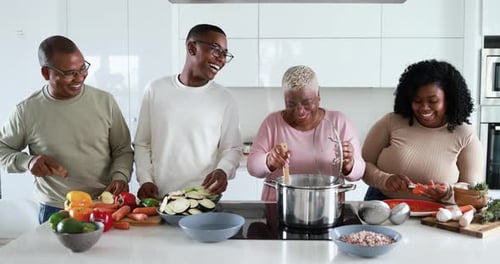 Happy Family Cooking Together in Bright Kitchen